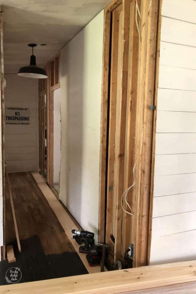 Remodeling a mobile home wall by removing the sheetrock and adding shiplap