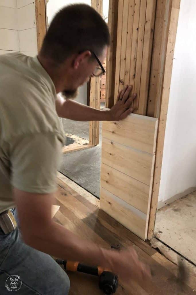 putting shiplap boards on a wall