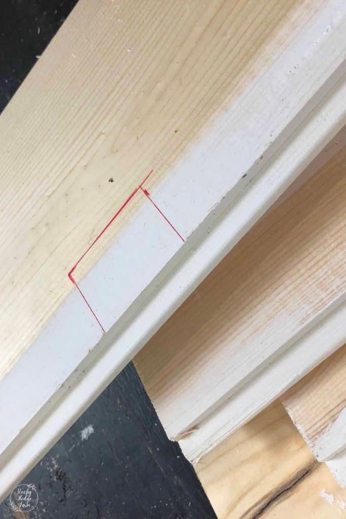 cutting a shiplap board to put around an outlet