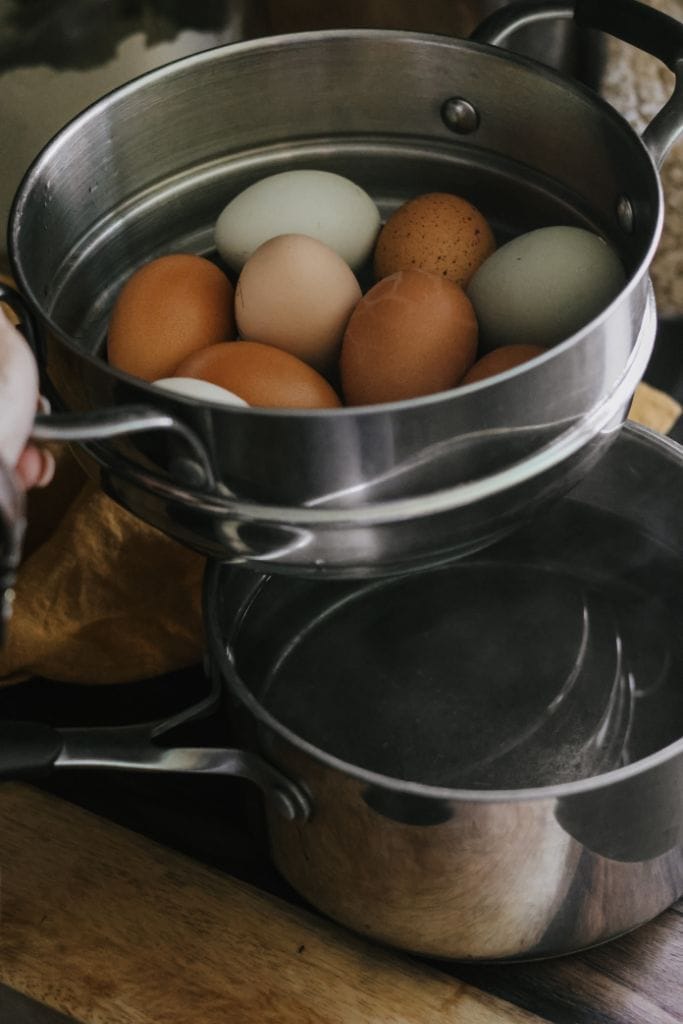 Fresh farm eggs steaming in a steamer basket