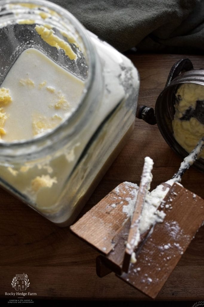 A butter churn filled butter and buttermilk. 