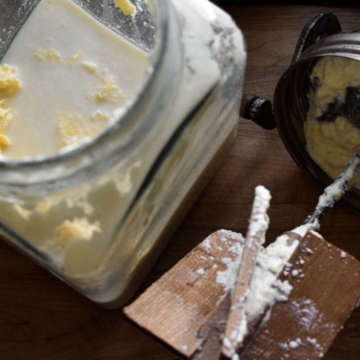 A butter churn filled butter and buttermilk.