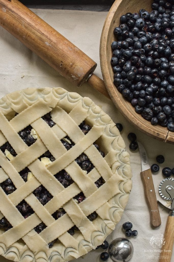 Uncooked blueberry pie with a lattice crust.
