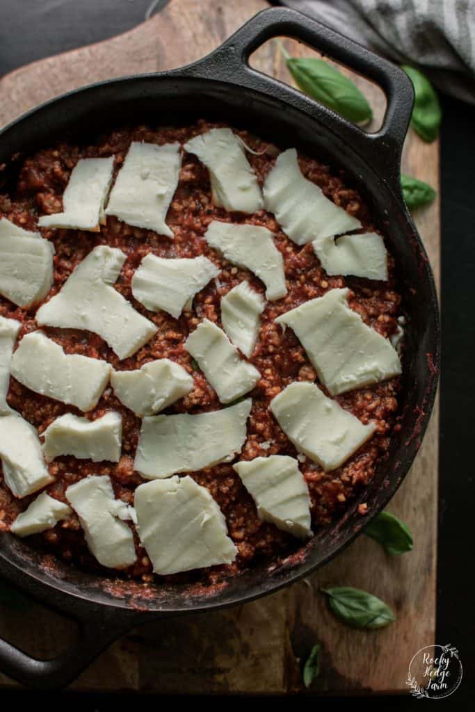 Mozzzarella Cheese Layered on Dutch Oven Lasagna