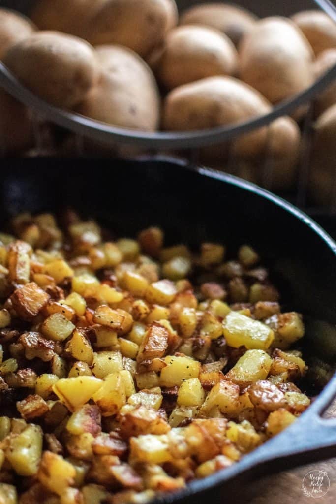 A cast iron skillet filled with crispy skillet fried potatoes