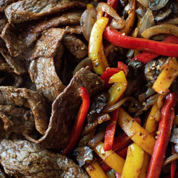 Vegetable and Beef Fajitas in a cast iron skillet