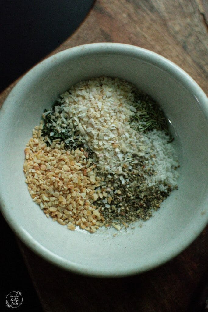 a white bowl filled with the seasonings for shepherds pie