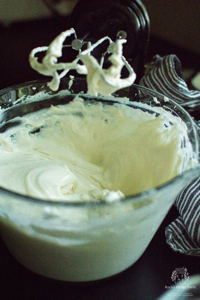 a bowl filled with cream cheese filling