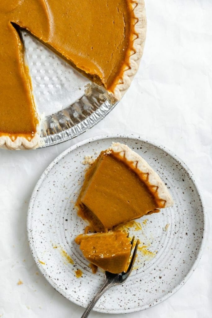 a slice of egg free pumpkin pie that is vegan