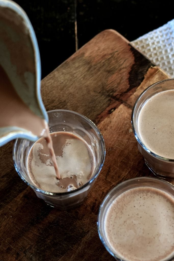 pouring a glass of chocolate milk