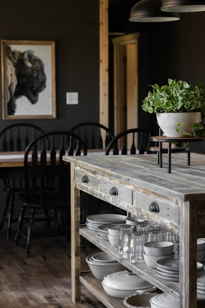 Cozy kitchen featuring a distressed wood island with a built-in breakfast nook. The island offers a warm and inviting atmosphere, perfect for casual meals and conversation.