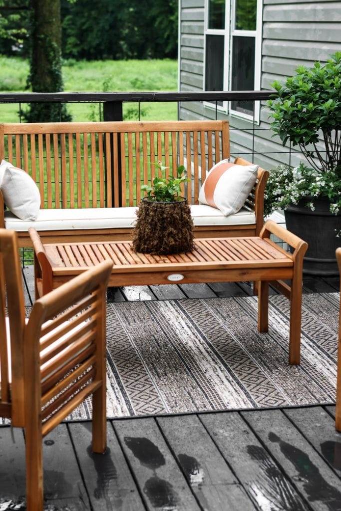 Budget-friendly makeover creates a charming manufactured home porch oasis.