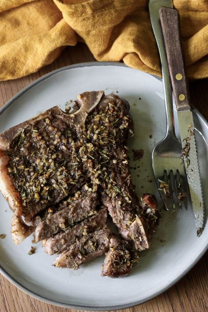 Sliced steak with pan drippings