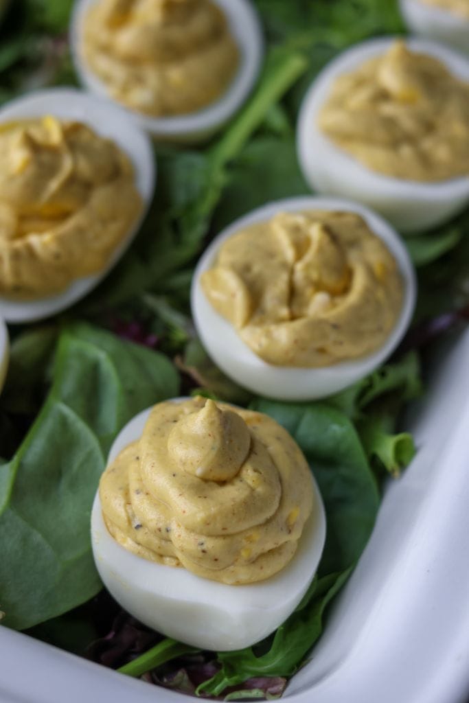 Hard-boiled egg whites filled with a savory deviled egg mixture, ready to be enjoyed.