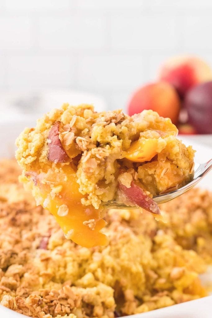 A spoonful of peach cobbler dump cake