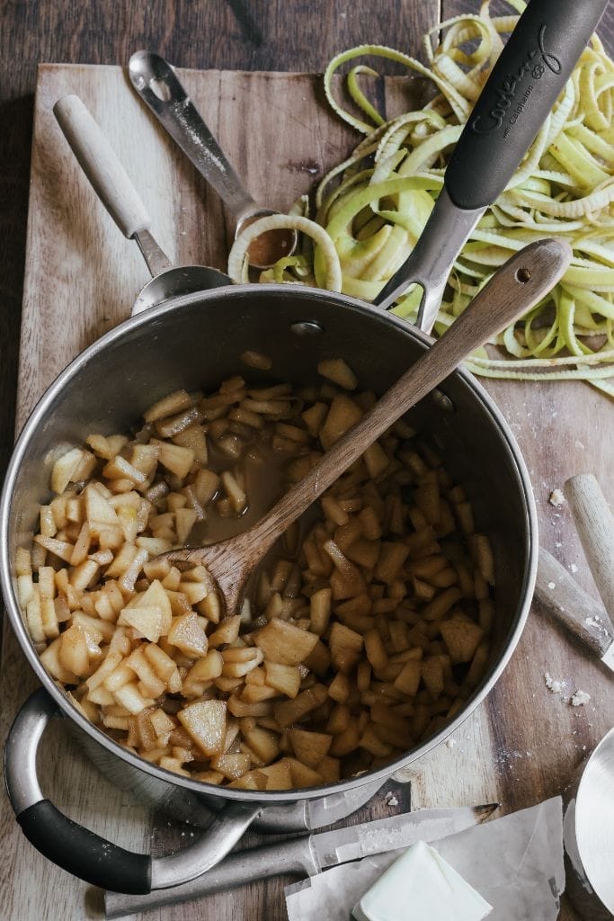 a pan filled diced apples for apple crisp bars