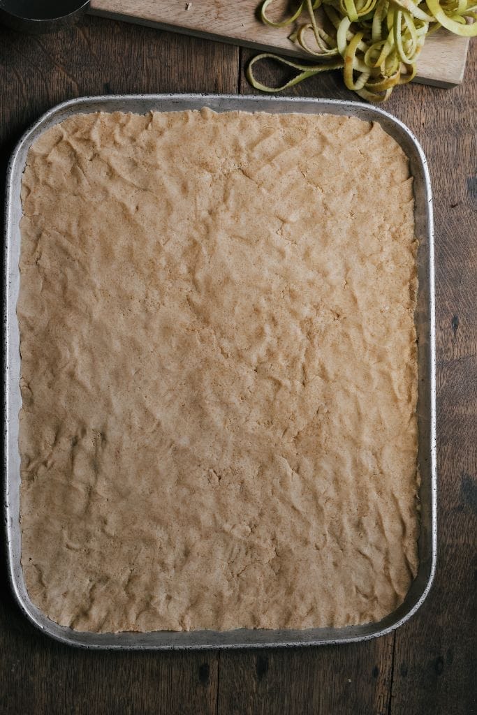 the apple crisp shortbread layer on a baking sheet