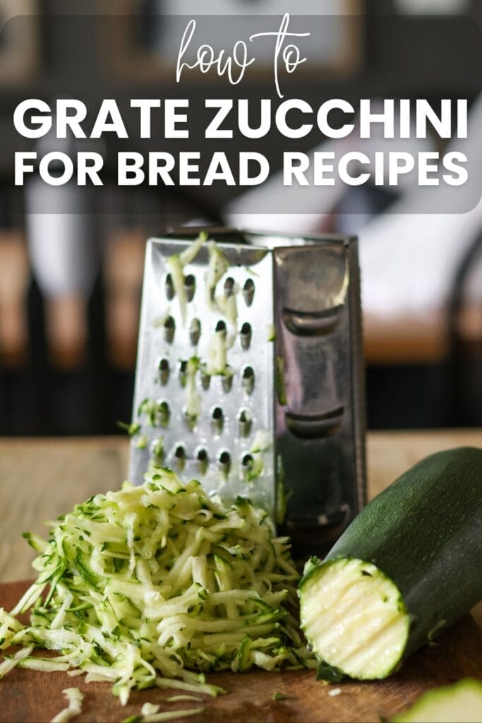 shredded zucchini in front of a box grater