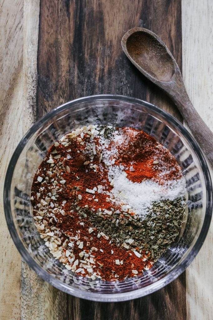 Mixing homemade fajita seasoning in a bowl