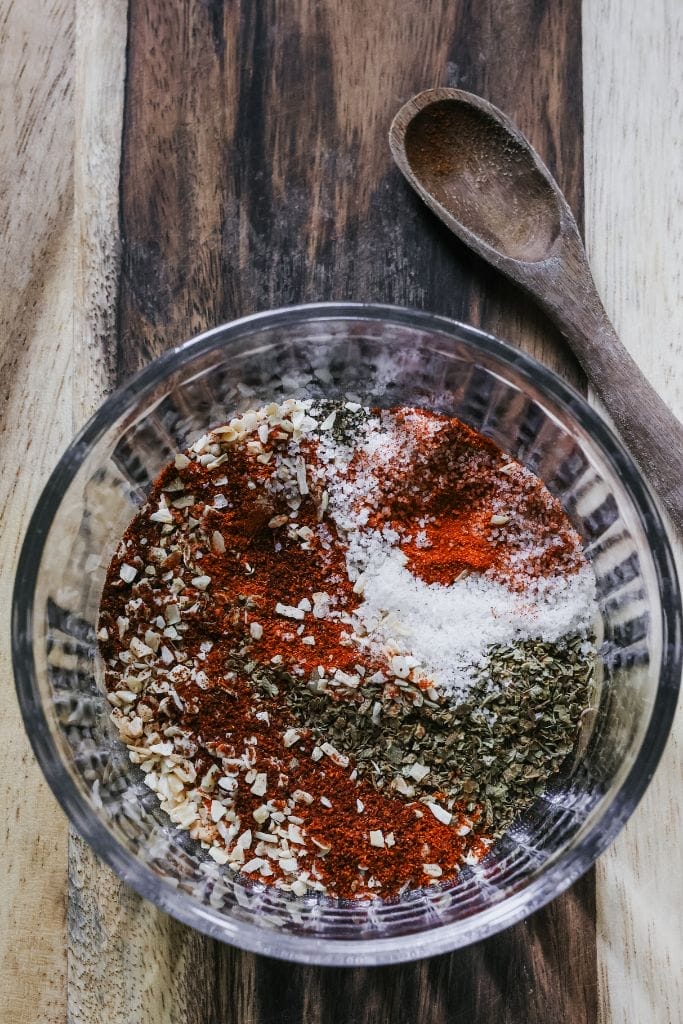 Mixing homemade fajita seasoning in a bowl