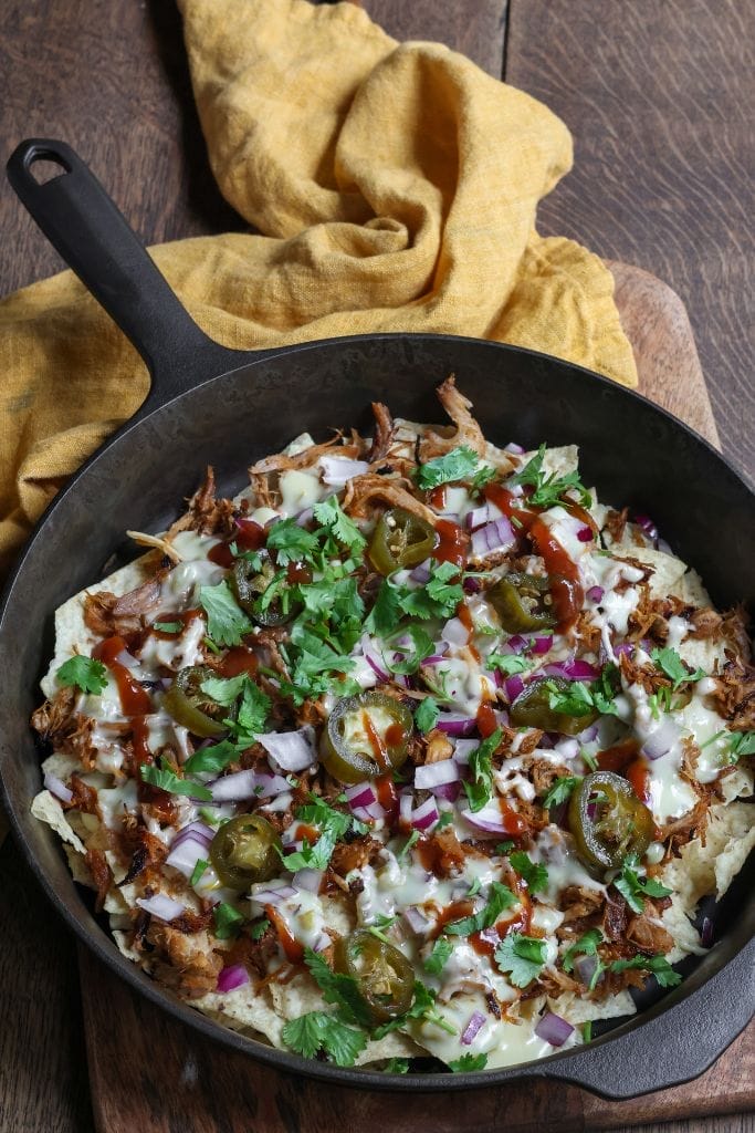 bbq nachos in a cast iron skillet