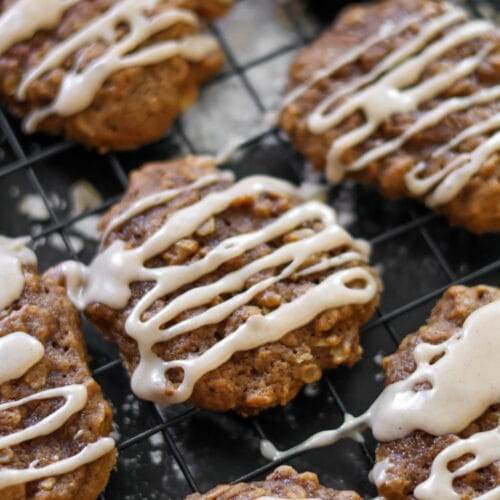 A beautiful arrangement of pumpkin oatmeal cookies, each drizzled with a sweet cinnamon maple glaze