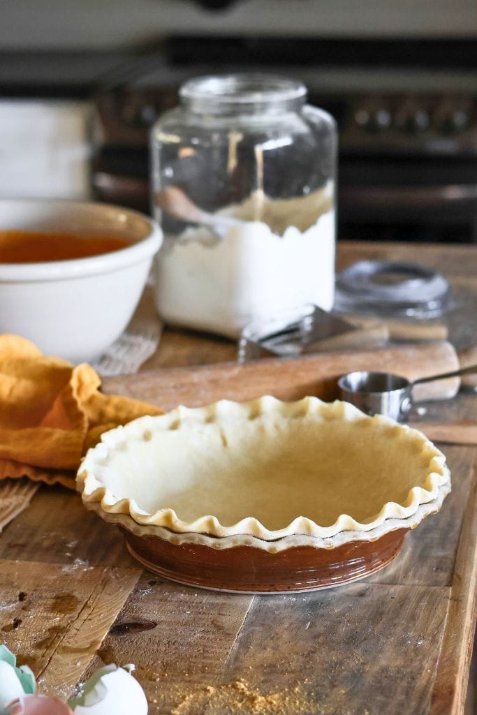 crimped pie dough in a pie plate