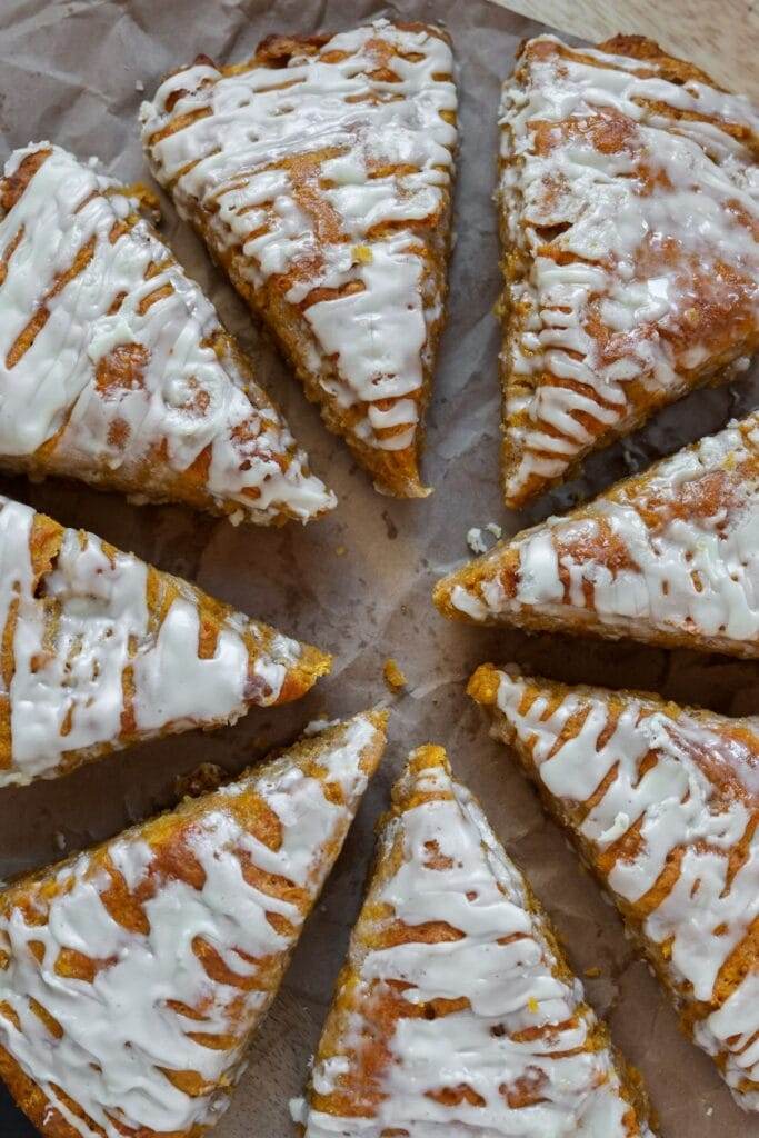 Fluffy pumpkin scones drizzled with maple glaze