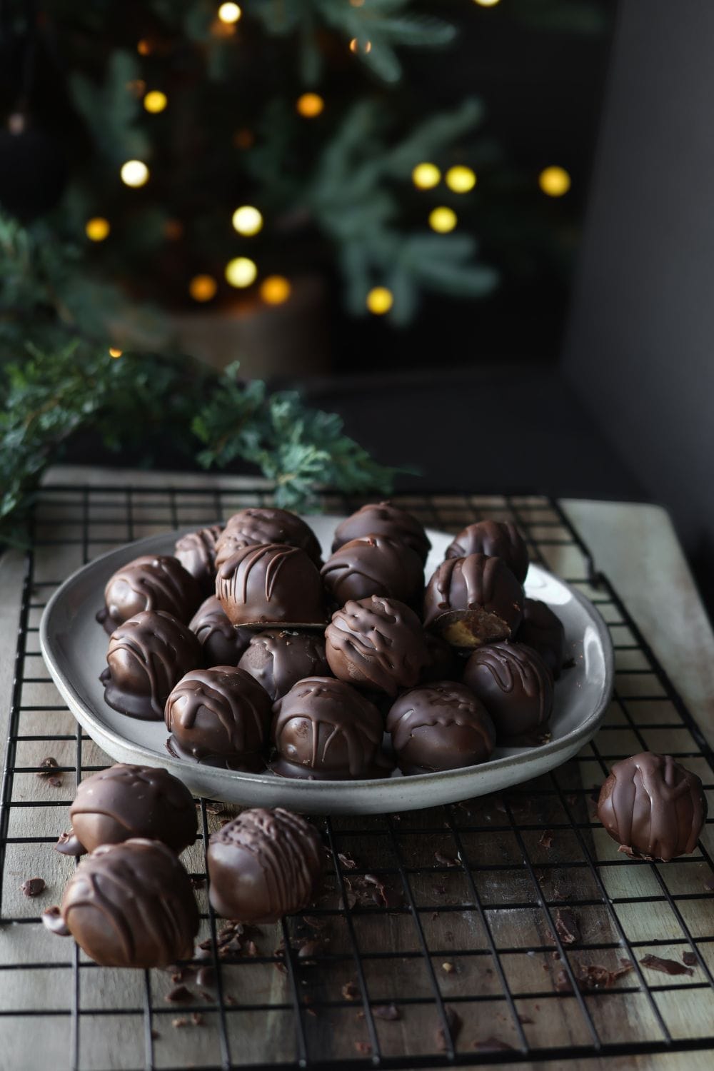 Finished peanut butter balls coated in chocolate, ready to enjoy.