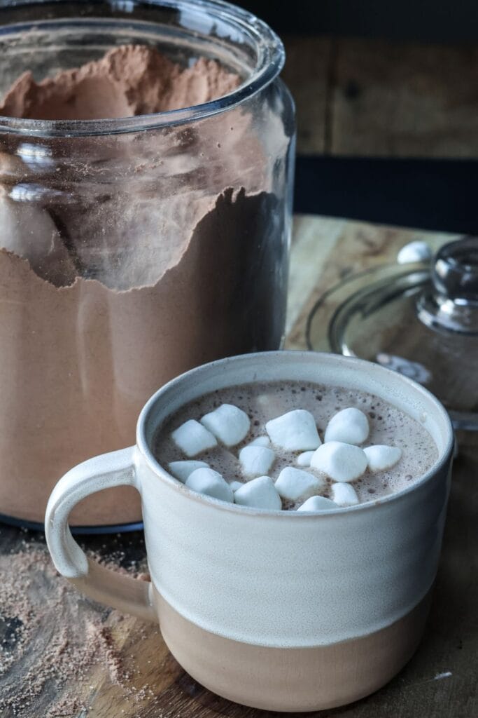 A cup of hot chocolate made from homemade cocoa mix and topped with marshmallows.